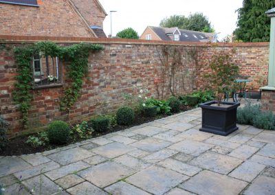 Clematis 'Frances Rivis' frames mirror in our courtyard garden project in Baldock.