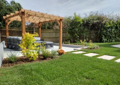 Porcelain stepping stones leading to a garden retreat.