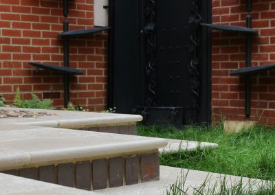 Limestone garden steps with bullnose profile.