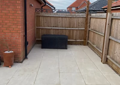 Porcelain paving in upper caldecote garden design.