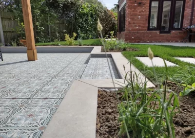 View across the sunken chill-out garden planted with ornamental grasses.